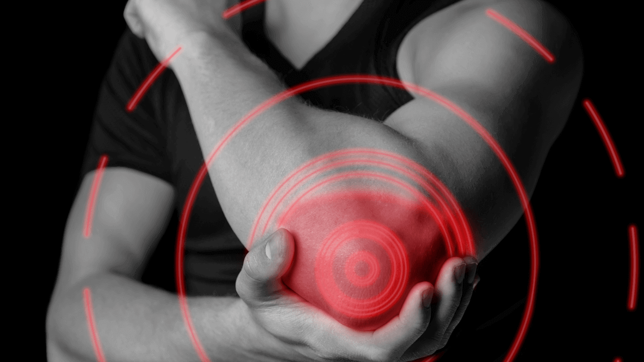 Will Omega-3s Help With A Muscle Tear (Like Rotator Cuff) - image of a man holding his elbow in pain.
