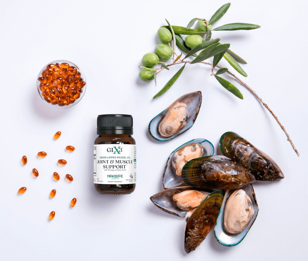 A bottle of GLX3 Joint & Muscle Support supplement is surrounded by green-lipped mussels,